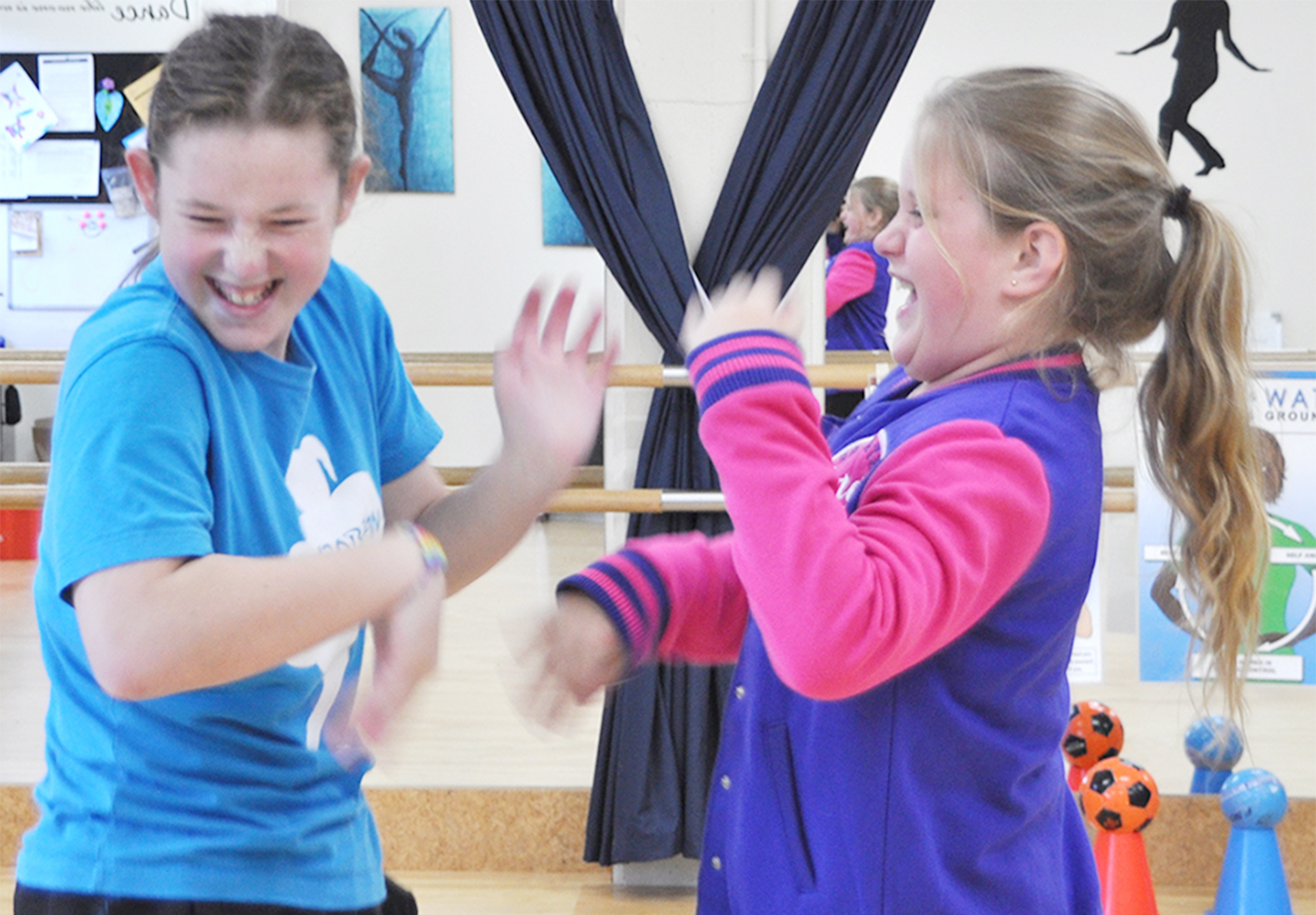 Girls laughing and enjoying their Rock and Water game